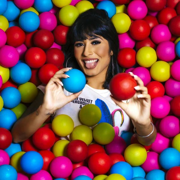 Smiling woman after a yoga session, looking refreshed and energetic.